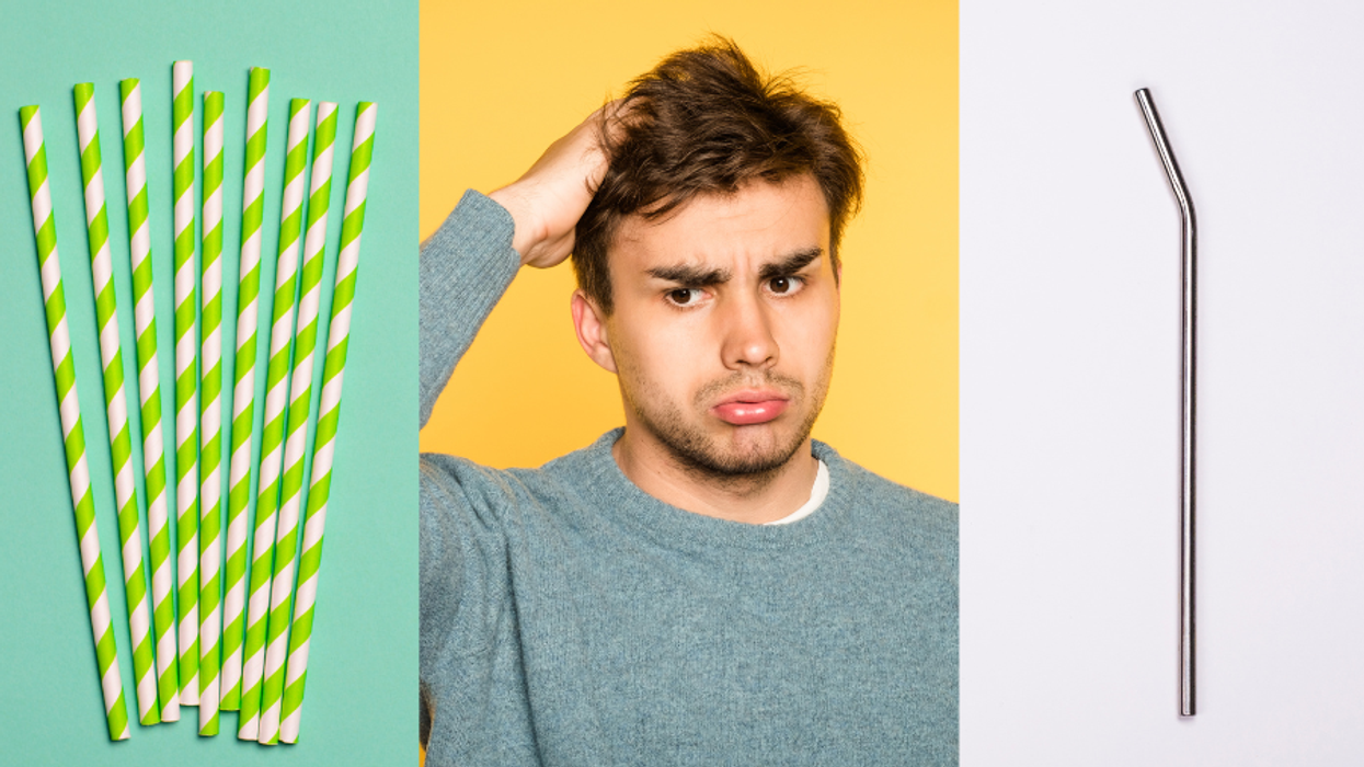 A person, surrounded by straws, looks confused