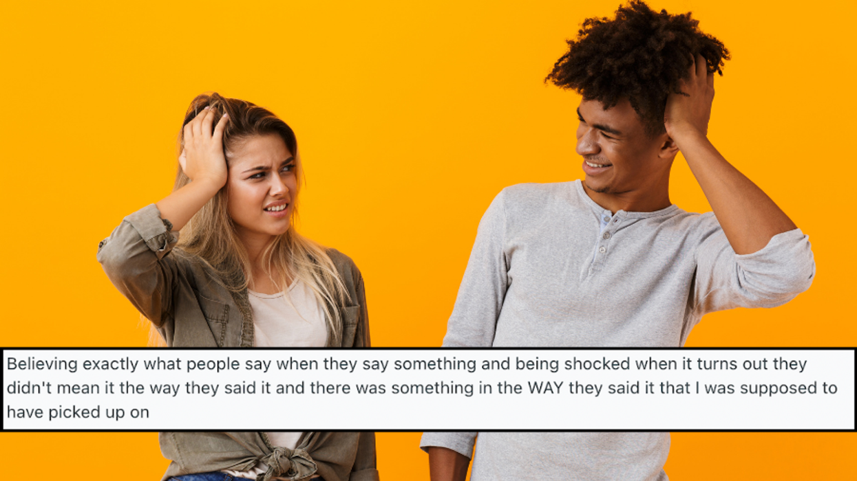 A photo of two people look at each other confused, with a Reddit comment pasted on top