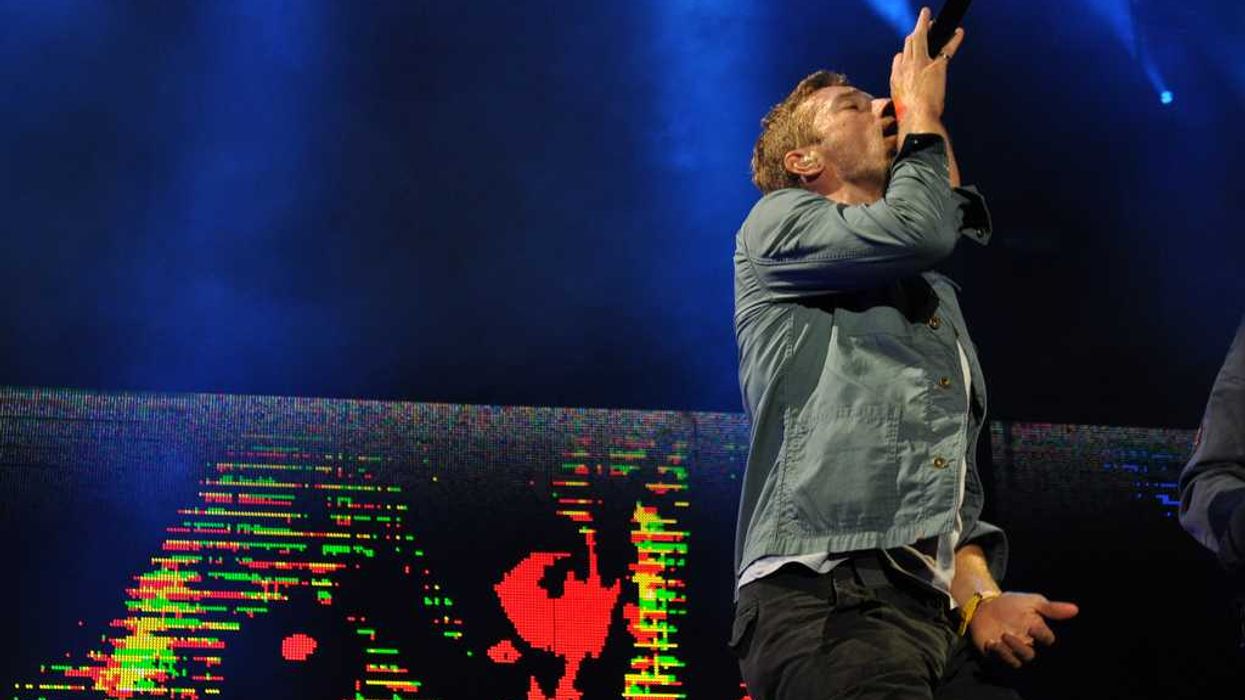 Coldplay, Chris Martin, Rob O'Byrne, crowd-surfing, wheelchair, concert, viral video, The Guardian, BBC, inspirational