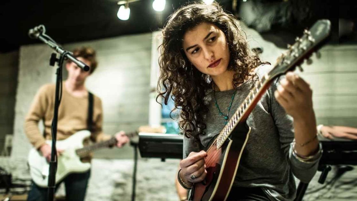 Woman has sassy response after a man mocked her for wearing a band tee. He didn't know she was in the band.