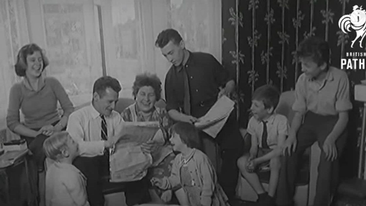 Incredible 1958 clip shows disabled 'super mom' of 7 using her feet to carry out her daily duties