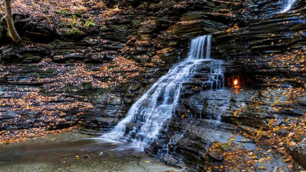 Explorer blown away after discovering 'eternal flame' burning beneath icy waterfall near New York