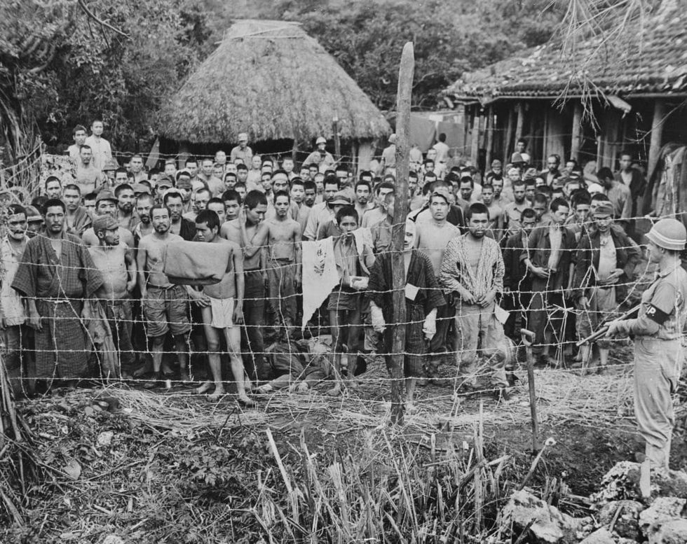 Image Source: A crowd of Japanese prisoners of war from the Imperial Japanese Army's (IJA) Thirty-Second Army at Okuku on Okinawa in the Ryukyu Islands of Japan. (Photo by Keystone/Hulton Archive/Getty Images).