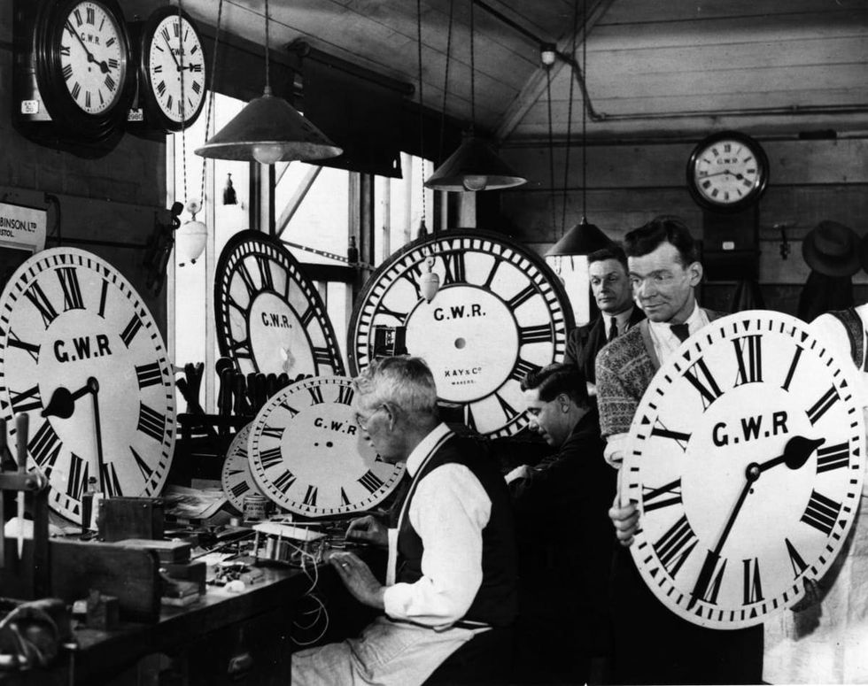 Image Source: A group of employees at the Great Western Railway's signal works in Reading, test and repair some of the company's many clocks. (Photo by Harry Todd/Getty Images)