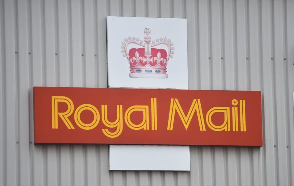 Image source: A Royal Mail logo is seen outside a sorting office on February 14, 2021 in Congleton, England . (Photo by Nathan Stirk/Getty Images)