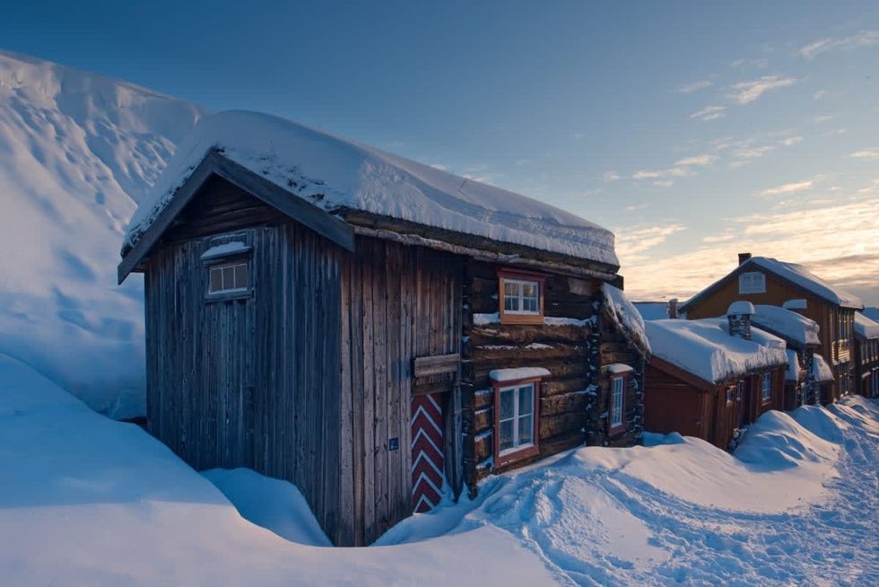 Image Source: A sunset on an old wooden cabin in the snow at Roros, UNESCO town, a snow path is leading to the cabin, Norway on February 25, 2018 (photo by Romain Chassagne/Art in All of Us/Corbis via Getty Images)