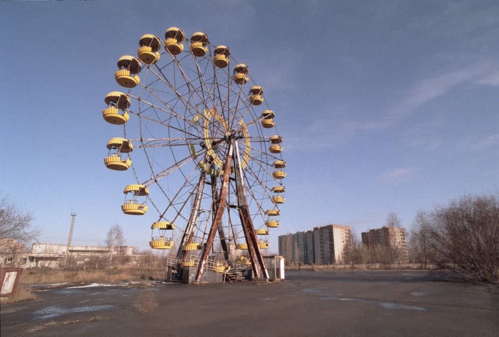 Image Source: Abandoned Ferris Wheel in the Pripyat Central Park, evacuated town, two kilometres from the Chernobyl power station, November 1995. (Photo by Martin Godwin/Getty Images)