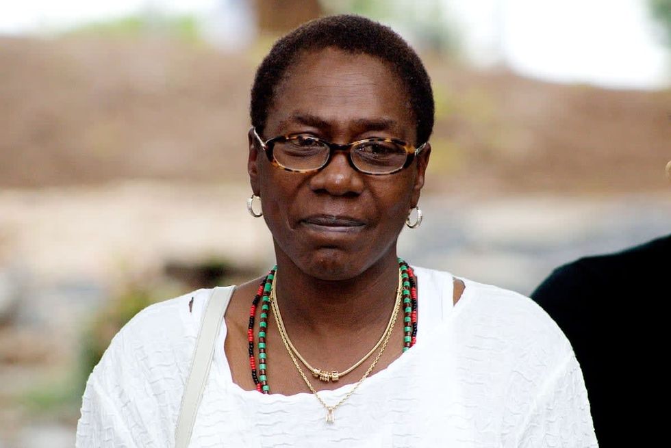 Image Source: Afeni Shakur-Davis, mother of the late Tupac Shakur, watches an African drum ceremony on September 9, 2006 in Stone Mountain, Georgia. (Photo by Annette Brown/Getty Images)