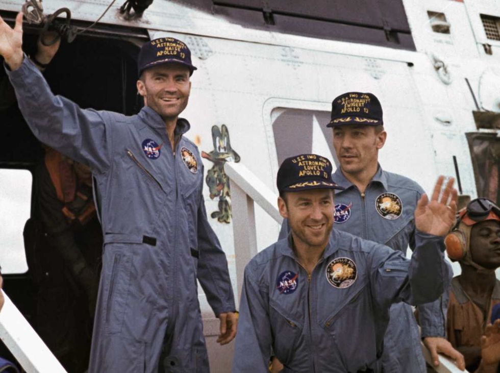 Image Source: After splashdown, Apollo 13 astronauts arrive by helicopter on deck of the carrier USS Iwo Jima. Left to right: Fred Haise, James Lovell, and John Swigert.