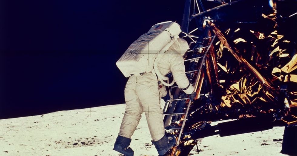 Image Source: American astronaut Edwin 'Buzz' Aldrin Jnr steps onto the lunar surface from the Apollo 11 lunar module to become the second man to walk on the moon. (Photo by Neil Armstrong/MPI/Getty Images)