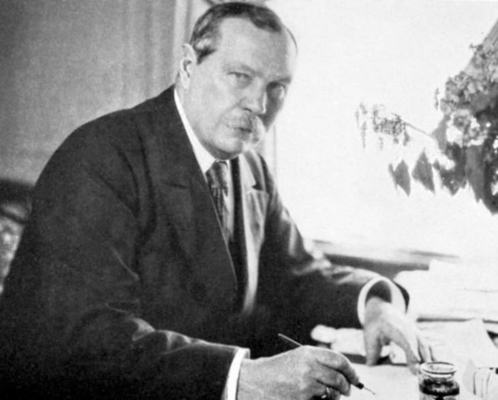 Image source: Arthur Conan Doyle (1859-1930), creator of the famous fictional detective Sherlock Holmes. Doyle did experiments in psychical research. (Photo by Ann Ronan Pictures/Print Collector/Getty Images)
