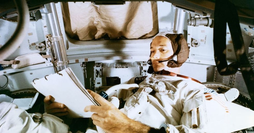 Image Source: Astronaut Michael Collins, command module pilot of the Apollo 11 lunar landing mission, studies flight plan during simulation training at the Kennedy Space Center in preparation for the scheduled July 16th mission. (Photo by Bettmann/Getty Images)