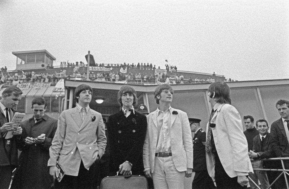 Image Source: British rock group the Beatles arrive back at London Airport after their final concert tour of the United States, UK, 1966. (Photo by Evening Standard/Hulton Archive/Getty Images)