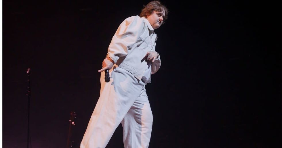 Image Source: British singer Lewis Capaldi performs live on stage during a concert at the Mercedes-Benz Arena on February 16, 2023 in Berlin, Germany. (Photo by Frank Hoensch/Redferns)