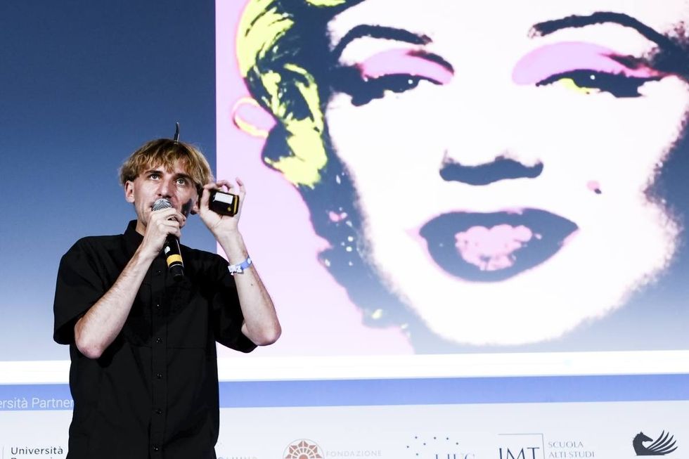 Image Source: Contemporary artist and cyborg activist Neil Harbisson best known for having an antenna implanted in his skull and for being officially recognised as a cyborg by a government attends Campus Party on July 21, 2017 in Milan, Italy. (Photo by Rosdiana Ciaravolo/Getty Images)