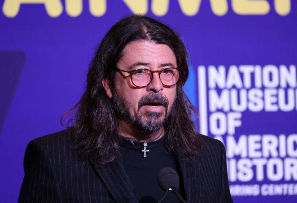 Image Source: Dave Grohl, founder of Foo Fighters, Nirvana drummer, director, author, and advocate in Washington, DC. (Photo by Paul Morigi/Getty Images)