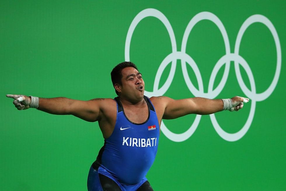 Image Source: David Katoatau of Kiribati reacts during the Men's 105kg Group B Weightlifting event in Rio de Janeiro, Brazil. (Photo by Tom Pennington/Getty Images)