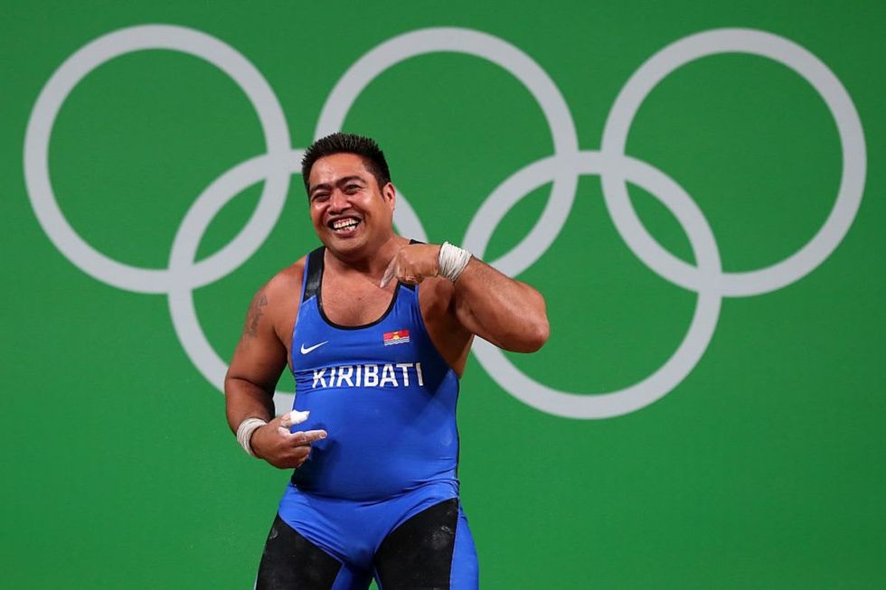 Image Source: David Katoatau of Kiribati reacts during the Men's 105kg Group B Weightlifting event in Rio de Janeiro, Brazil. (Photo by Tom Pennington/Getty Images)