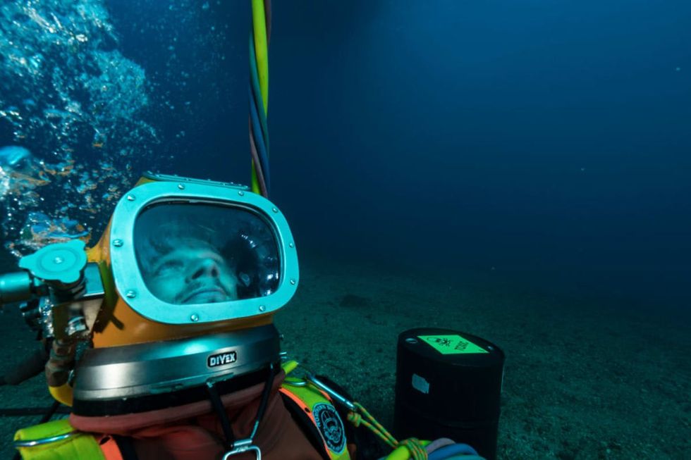Image source: Exercise for diver students in hostile environments in Saint-Mandrier-Sur-Mer, France. They are equipped with a DIVEX to operate in chemical products and the nuclear environment. (Photo by Alexis Rosenfeld/Getty Images)