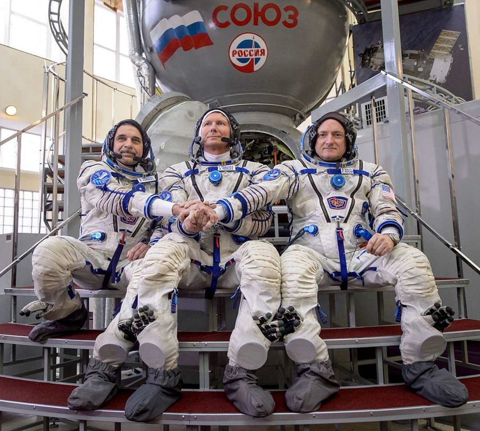 Image Source: Expedition 43 Russian cosmonaut Mikhail Kornienko of the Russian Federal Space Agency (Roscosmos), Russian cosmonaut Gennady Padalka of Roscosmos and NASA Astronaut Scott Kelly. (Photo by /Bill Ingalls/NASA via Getty Images)