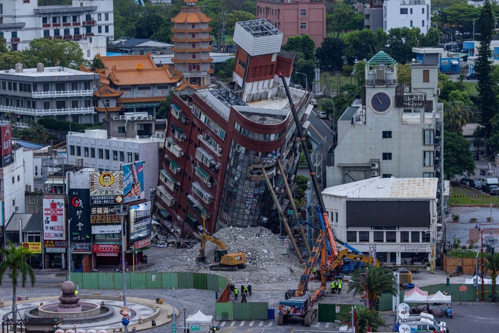 Image Source: General view of a collapsed building following the earthquake on April 05, 2024 in Hualien, Taiwan. (Photo by Annabelle Chih/Getty Images)