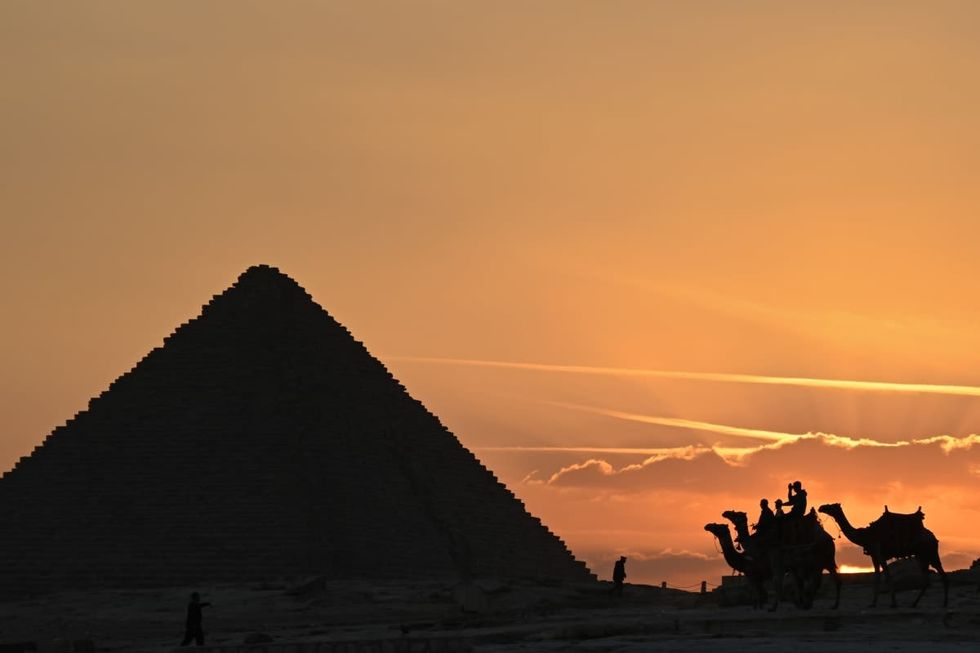 Image Source: GIZA, EGYPT - DECEMBER 02: View of the Pyramid of Khafre at sunset on December 02, 2022 in Giza, Egypt. (Photo by Stephane Cardinale - Corbis/Corbis via Getty Images)