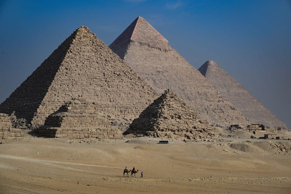 Image Source: GIZA, EGYPT - DECEMBER 03: General view of the Giza Pyramids on December 03, 2022 in Giza, Egypt. (Photo by Stephane Cardinale - Corbis/Corbis via Getty Images)