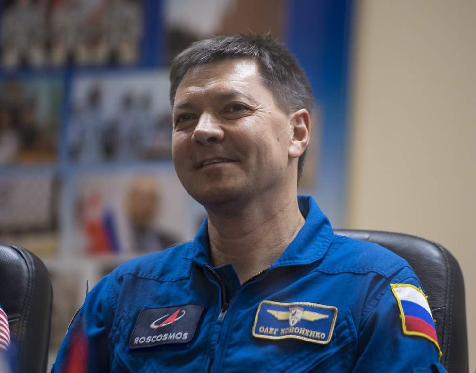 Image Source: In this handout provided by NASA, Expedition 58 Soyuz Commander Oleg Kononenko of Roscosmos, attends a press conference on December 2, 2018, at the Cosmonaut Hotel in Kazakhstan. (Photo by Aubrey Gemignani/NASA via Getty Images)