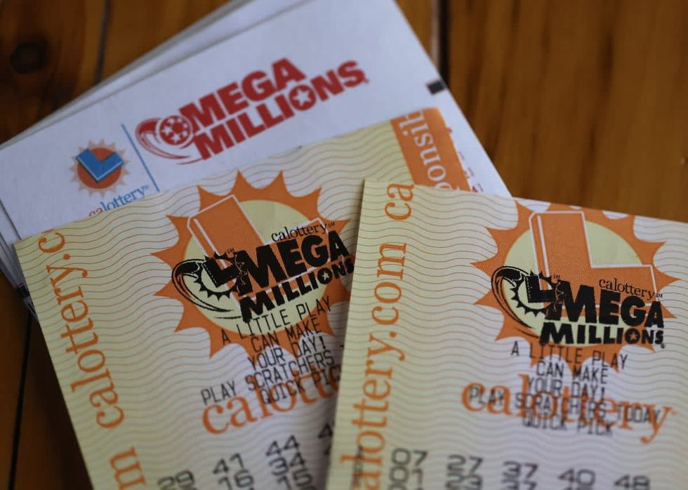 Image Source: In this photo illustration, Mega Millions lottery tickets are displayed on August 01, 2023 in San Anselmo, California. (Photo Illustration by Justin Sullivan/Getty Images)