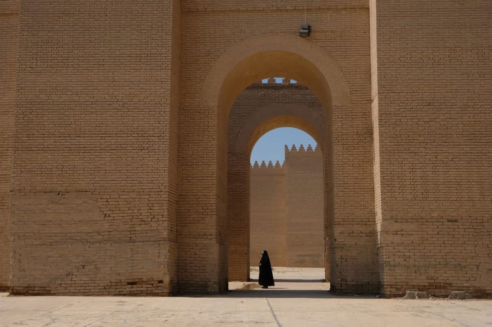 Image Source:  Iraqis visit the ruins of Babylon on March 21, 2023 in Babylon, Iraq. (Photo by Kaveh Kazemi/Getty Images)