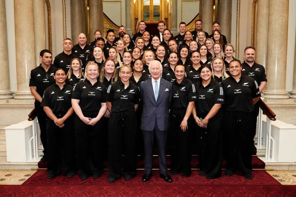 Image Source: King Charles III has his photograph taken with New Zealand's Black Ferns rugby union team on the Grand Staircase at Buckingham Palace on September 11, 2024 in London, England. (Photo by Aaron Chown - WPA Pool/Getty Images)