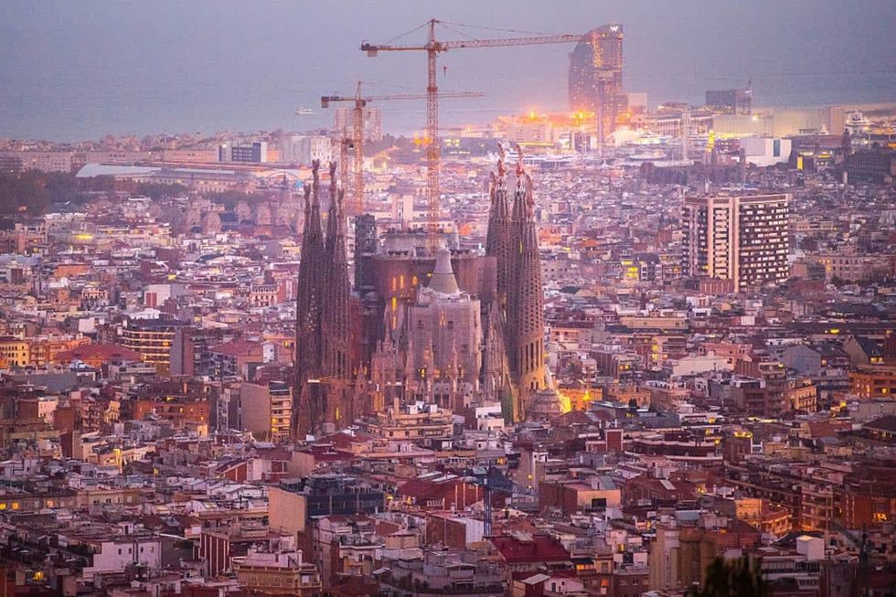 Image Source: La Sagrada Familia' stands over residential buildings on October 26, 2015 in Barcelona, Spain. The first stone was laid on March 19, 1882. (Photo by David Ramos/Getty Images)