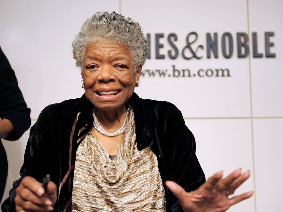 Image Source: Maya Angelou addresses audience members during a book signing for her book,