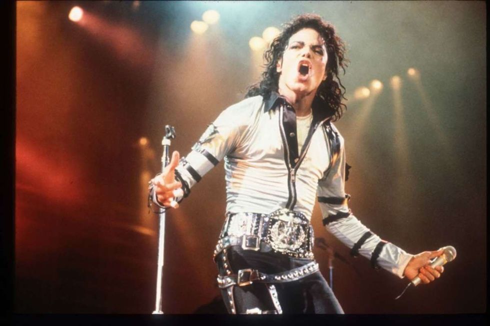 Image Source: Michael Jackson performs at a concert November 8, 1988 in California. Jackson reached the peak of his solo career with 1982's