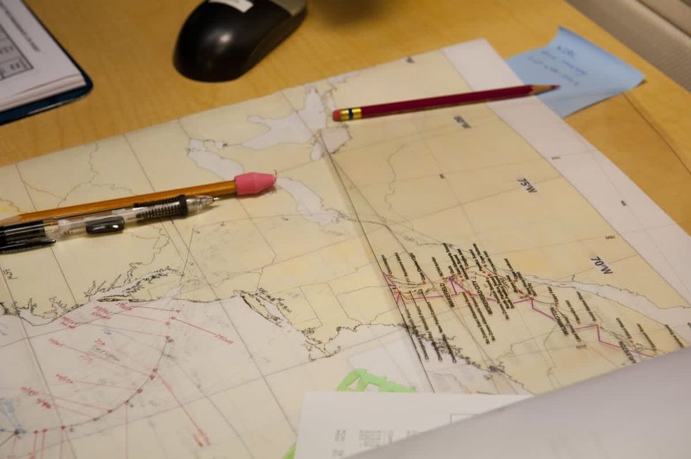 Image Source: National Hurricane Center Going Over The Next Advisory For Hurricane Sandy. (Photo by Michele Eve Sandberg/Corbis via Getty Images)