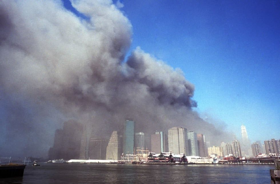 Image Source: Neville Elder's photographs of downtown Manhattan on 9/11/01 were published worldwide. The picture shows the Downtown Manhattan skyline (view from Brooklyn) as it was on September 11, 2001. (Photo by Neville Elder/Getty Images)
