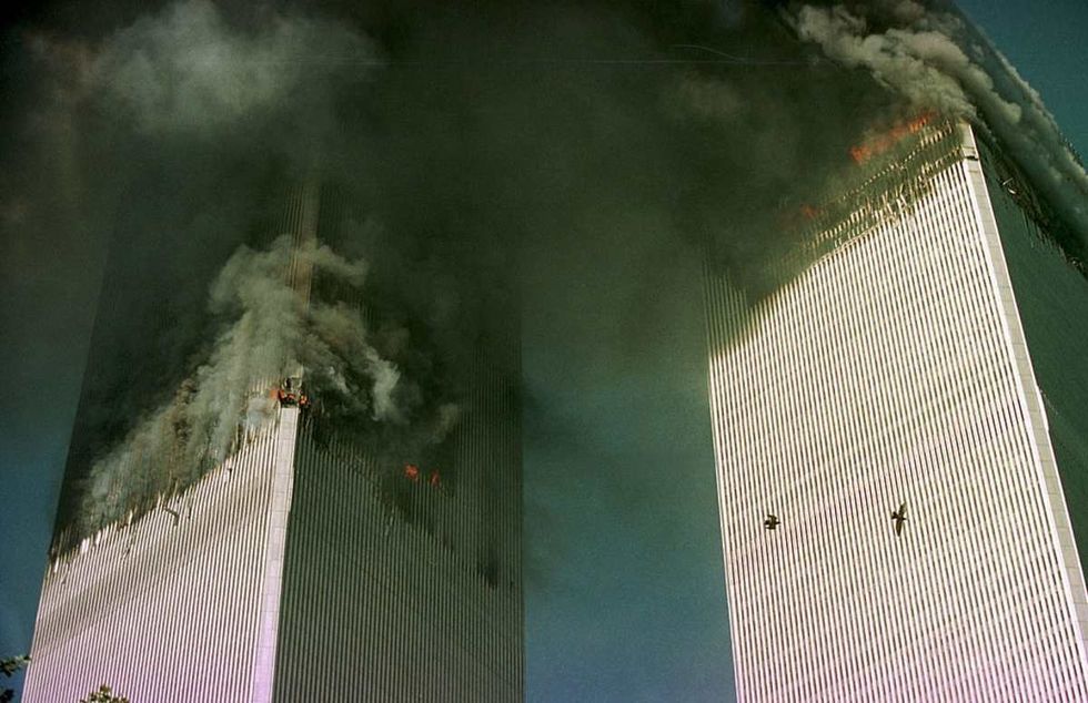 Image Source: NEW YORK - SEPTEMBER 11: The World Trade Center is engulfed in flames just before the south tower collapsed September 11, 2001 in New York City. (Photo by Thomas Nilsson/ Getty Images)