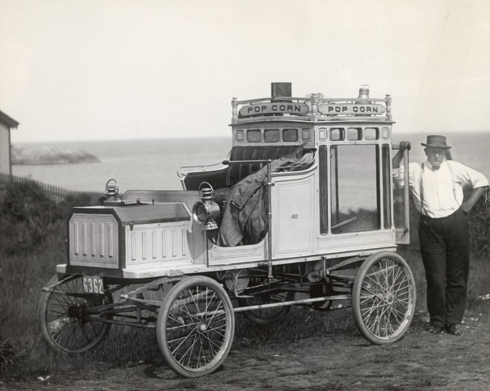 Image Source: Portrait of Early Popcorn Vendor Next to His Automobile