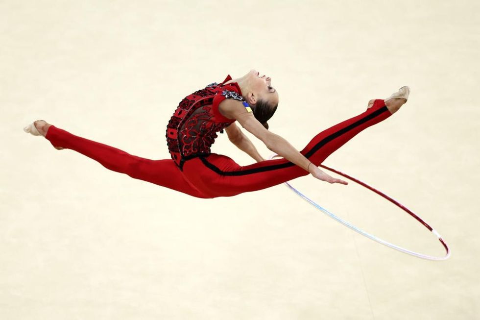 Image Source: Taisiia Onofriichuk of Team Ukraine competes during the Rhythmic Gymnastics Individual All-Around Qualification at Porte de La Chapelle Arena on August 08, 2024 in Paris, France. (Photo by Naomi Baker/Getty Images)