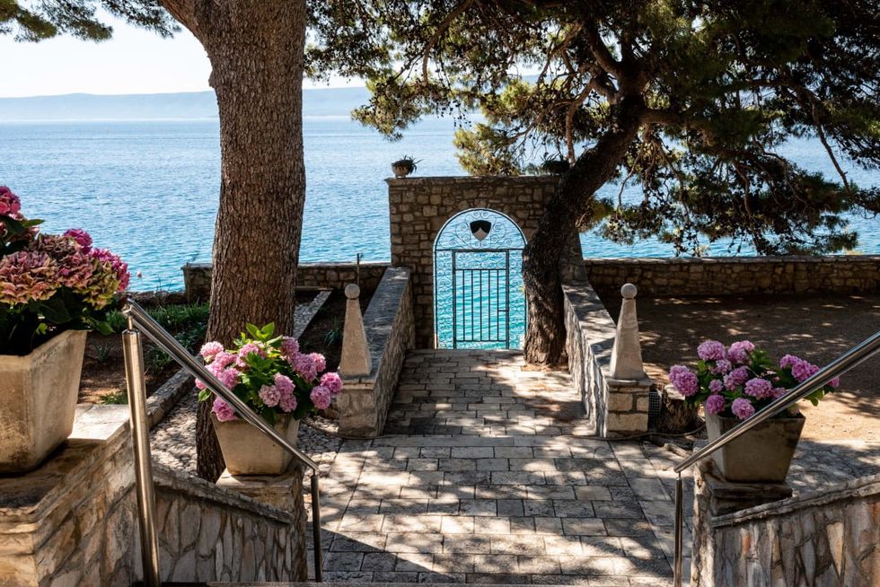 Image Source: The Dominican Monastery private garden opens onto the sea facing Hvar island on June 28, 2021 in Bol, Croatia. (Photo by Elisabetta Zavoli/Getty Images)