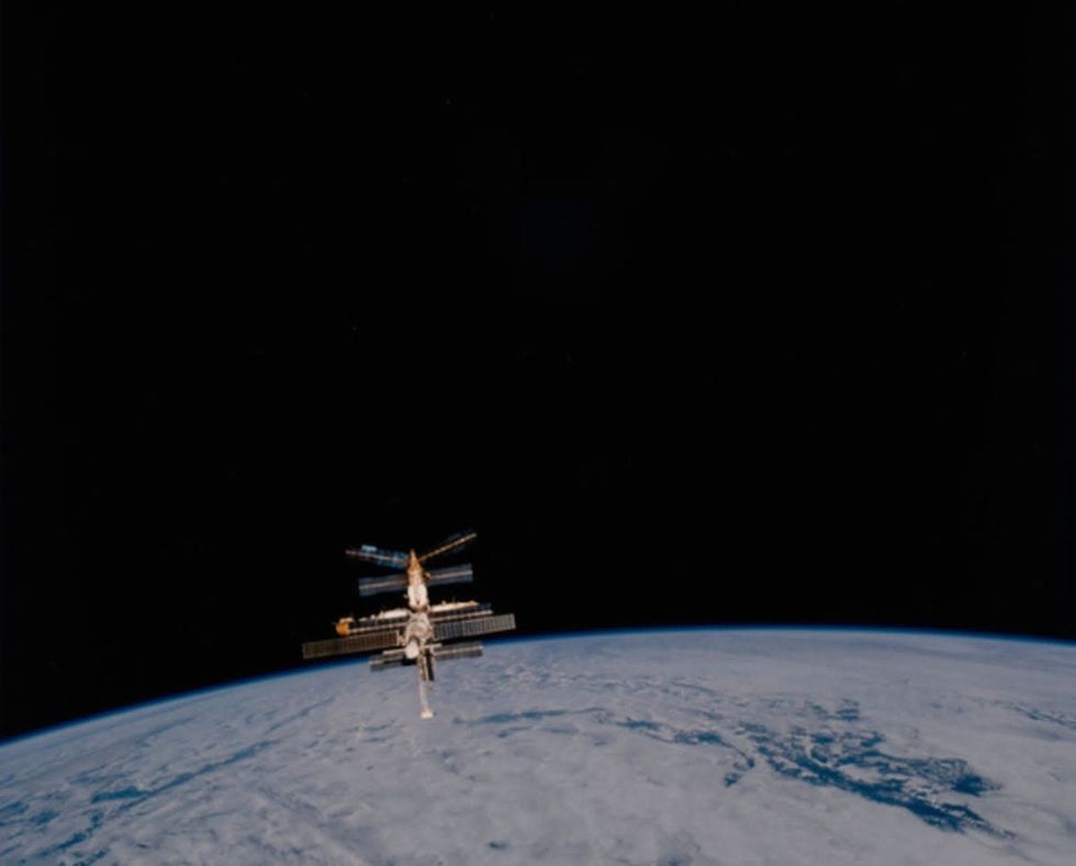 Image source: The Russian Space Station Mir backdropped against the darkness of space and the Planet Earth after Mir had separated from the Space Shuttle Atlantis in January 1997. (Photo by Space Frontiers/Archive Photos/Hulton Archive/Getty Images)