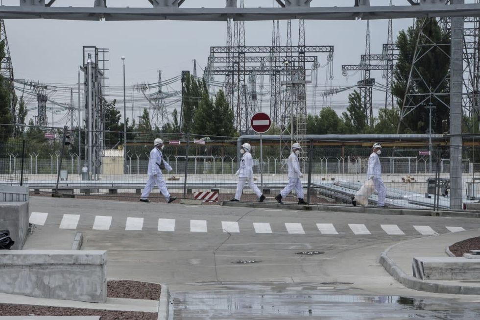 Image Source: Workers at the Chernobyl Nuclear Power Plant on July 2, 2019 in Pripyat, Ukraine (Photo by Brendan Hoffman/Getty Images)