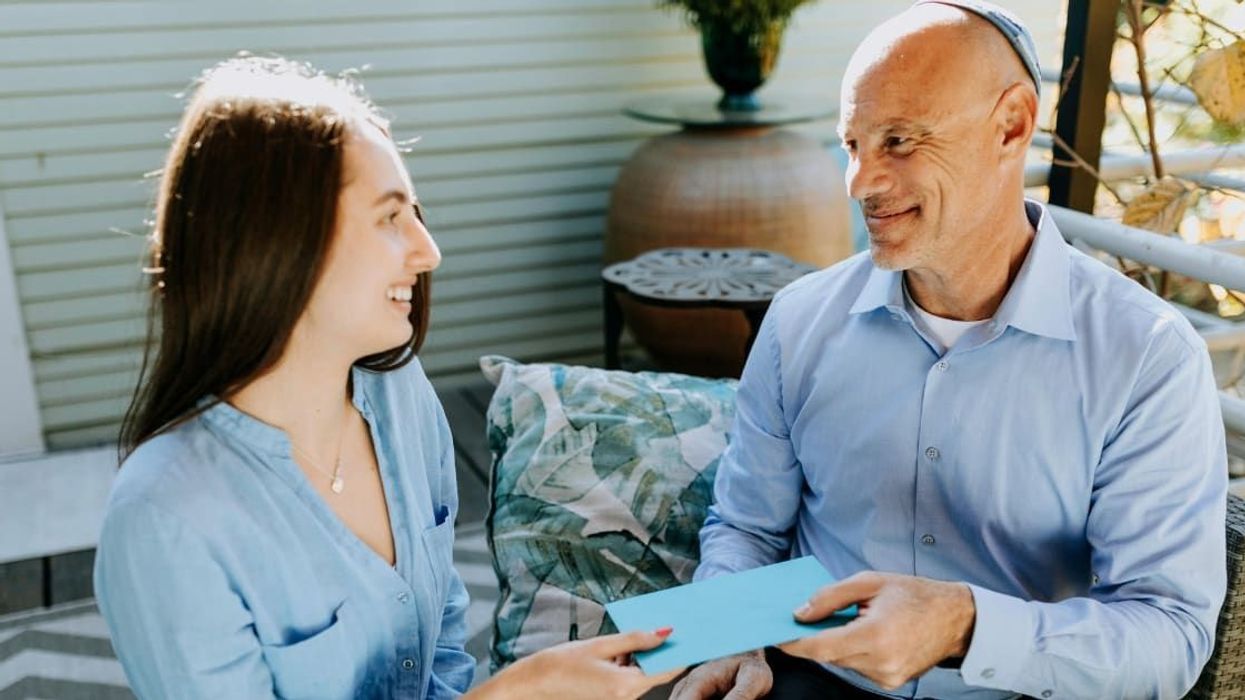 Dad who was in debt after sending daughter to unaffordable college moved to tears by a holiday miracle