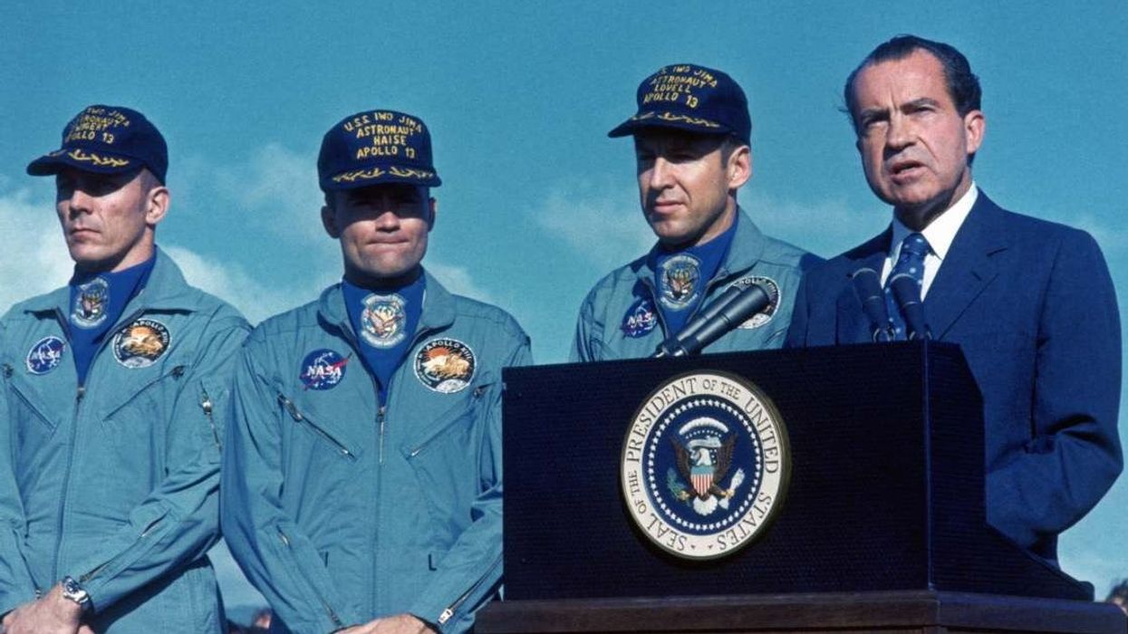 Three astronauts who raced to earth with oxygen running out and the whole world watching