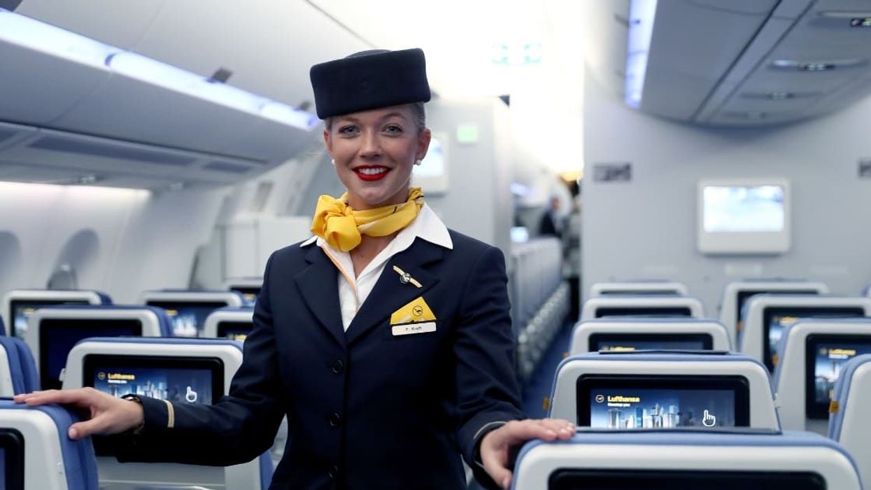 Here's why flight attendants greet boarding passengers and it's not just about being polite