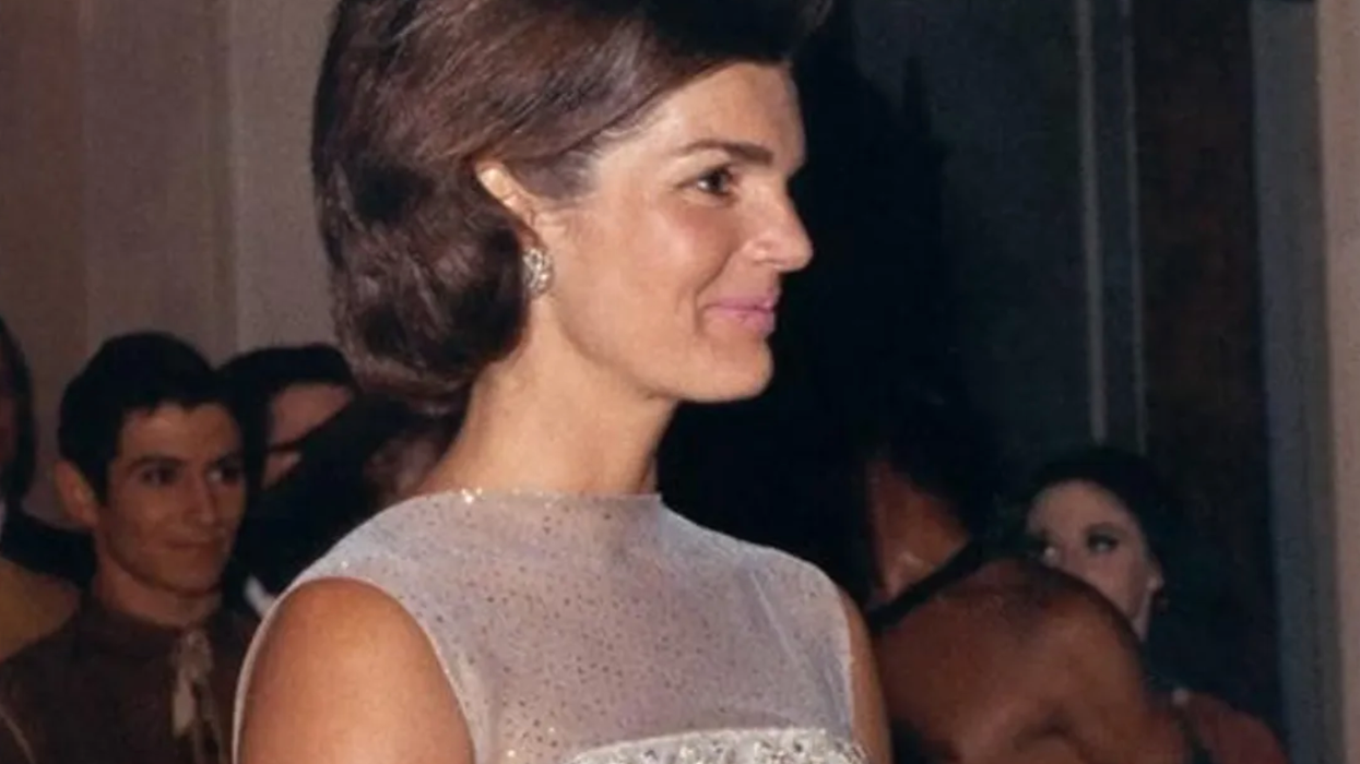 Jacqueline Kennedy stands at a 1962 State Dinner at the White House