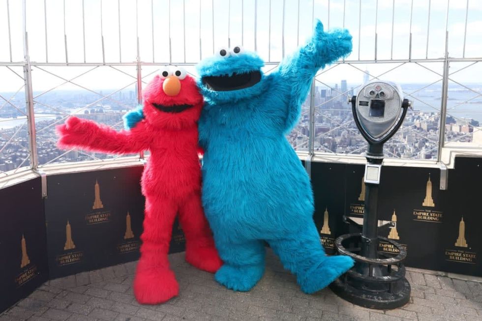NEW YORK, NEW YORK - FEBRUARY 18: Elmo and Cookie Monster celebrate the return of Sesame Street Live! at The Empire State Building on February 18, 2022 in New York City. (Photo by Dimitrios Kambouris/Getty Images for Empire State Realty Trust)