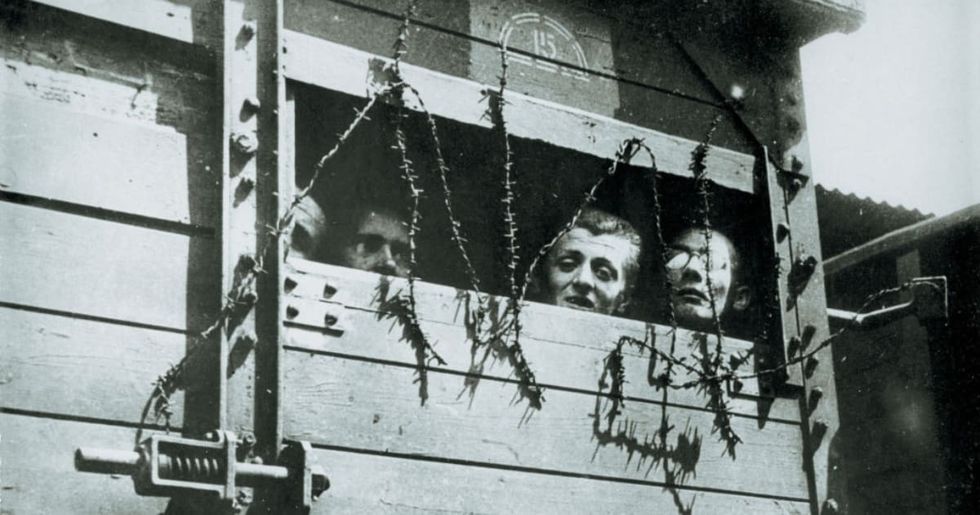 Representational Image Source : Holocaust-transport to a concentration camp in Poland: four men are looking outside of a nailed up scuttle on a railway-car. Photography. 1943. (Photo by Imagno/Getty Images)