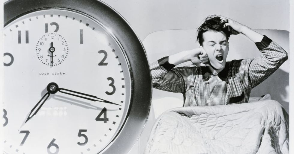 Representational Image Source : Man waking up to alarm clock.((Photo by Bettmann/Getty Images)
