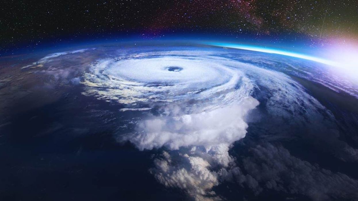Spectacular pictures from space show the eye of tropical cyclone illuminated by lightning